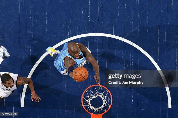 Johan Petro of the Denver Nuggets shoots a layup during the game against the Memphis Grizzlies at the FedExForum on March 13, 2010 in Memphis,...