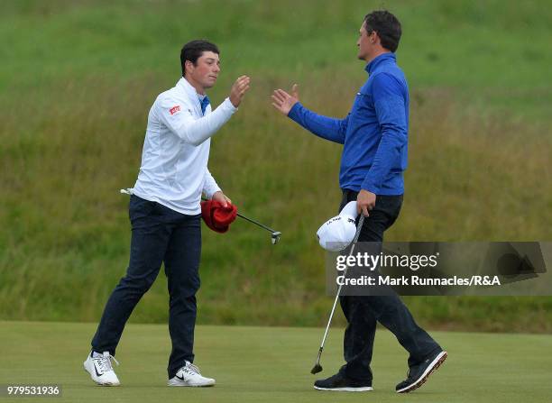 Victor Hovland of Norway , is congratulated by Lukas Euler of Germany after his 5&4 victory during the third day of The Amateur Championship at Royal...