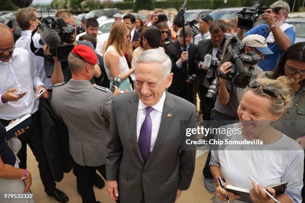 Defense Secretary James Mattis walks back toward the Pentagon after talking with journalists before the arrival of German Defence Minister Ursula von...