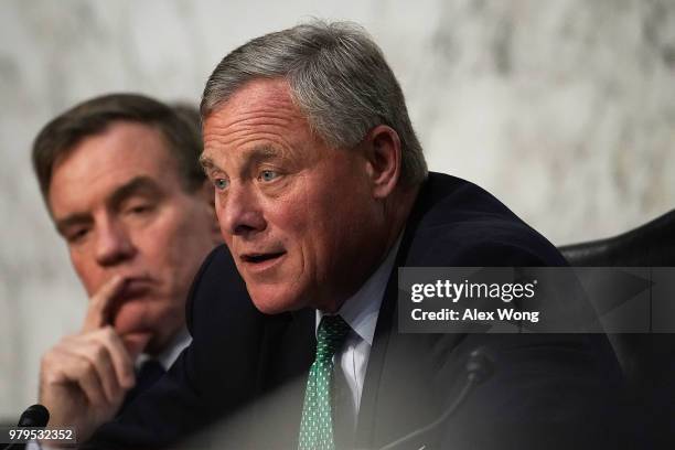 Senate Intelligence Committee Chairman Sen. Richard Burr speaks as Vice Chairman Sen. Mark Warner listens during a hearing before the committee June...