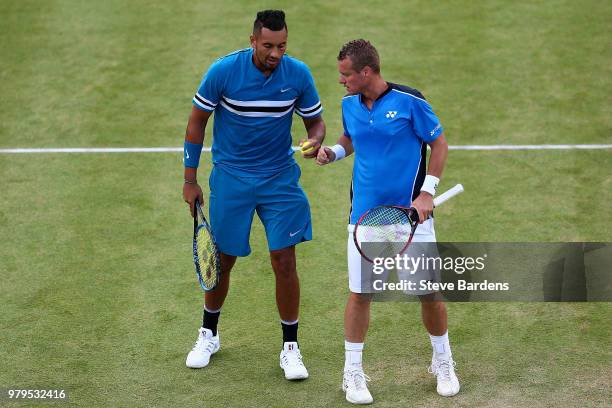 Nick Kyrgios and Lleyton Hewitt of Australia in action during their doubles match against Pierre-Hughes Herbert and Nicolas Mahut of France on Day...