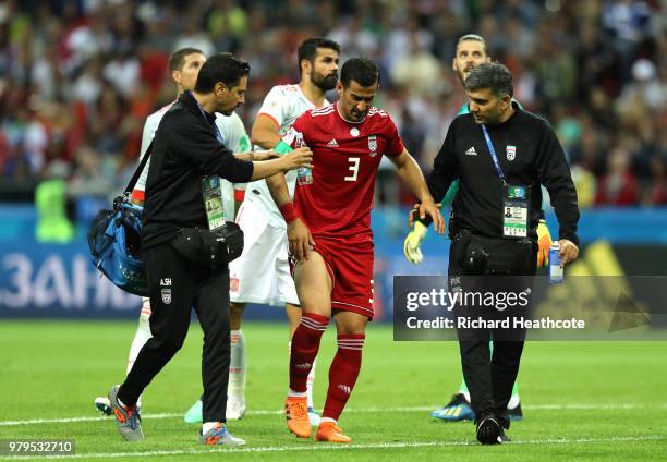 Ehsan Haji Safi of Iran leaves the pitch injured during the 2018 FIFA World Cup Russia group B match between Iran and Spain at Kazan Arena on June...