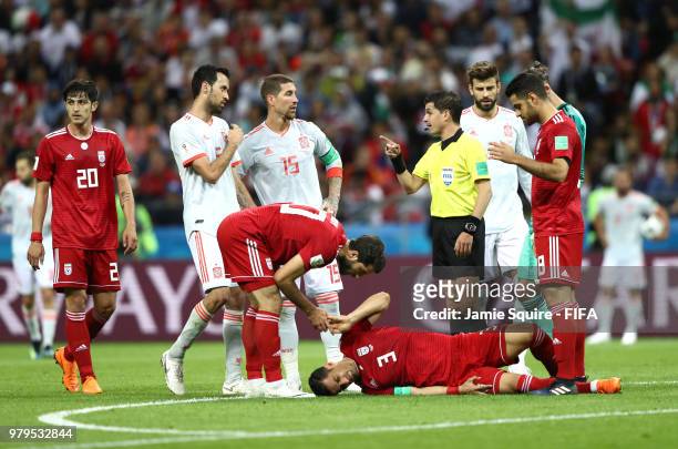 Ehsan Haji Safi of Iran lies on the pitch injured during the 2018 FIFA World Cup Russia group B match between Iran and Spain at Kazan Arena on June...