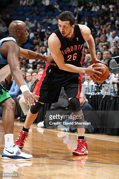Hedo Turkoglu of the Toronto Raptors protects the ball against Damien Wilkins of the Minnesota Timberwolves during the game on March 22, 2010 at the...