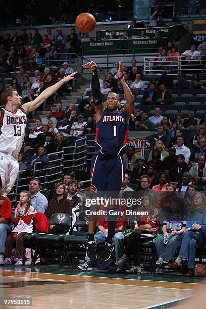 Maurice Evans of the Atlanta Hawks shoots a jumpshot against Luke Ridnour of the Milwaukee Bucks on March 22, 2010 at the Bradley Center in...