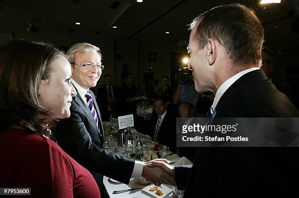 Australian Prime Minister Kevin Rudd and opposition leader Tony Abbott shake hands upon arrival at the National Press Club on March 23, 2010 in...
