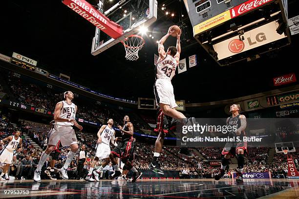 Kris Humphries of the New Jersey Nets dunks against the Miami Heat on March 22, 2010 at the IZOD Center in East Rutherford, New Jersey. NOTE TO USER:...