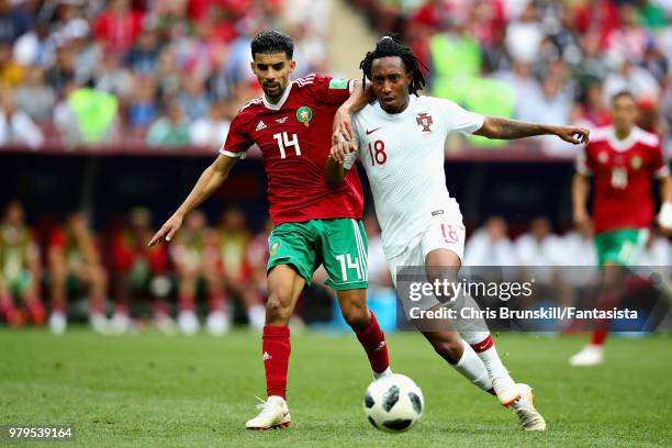 Gelson Martins of Portugal is challenged by Mbark Boussoufa of Morocco during the 2018 FIFA World Cup Russia group B match between Portugal and...