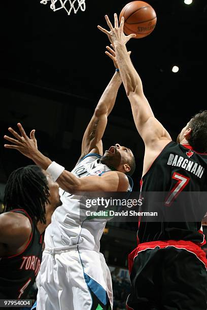 Wayne Ellington of the Minnesota Timberwolves shoots over Andrea Bargnani of the Toronto Raptors during the game on March 22, 2010 at the Target...
