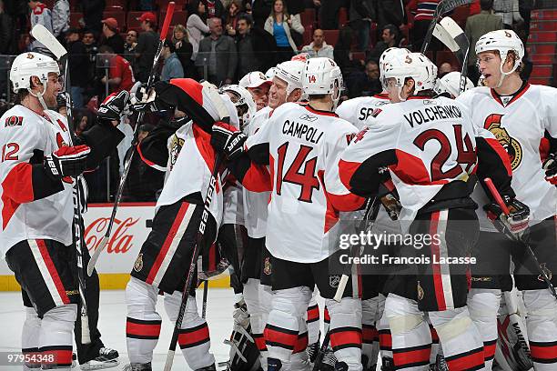 Chris Campoli of the Ottawa Senators ceebrates a goal with teammate Anton Volchenkov during the NHL game against the Montreal Canadiens on March 22,...