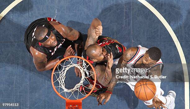 Terrence Williams of the New Jersey Nets shoots against Quentin Richardson of the Miami Heat on March 22, 2010 at the IZOD Center in East Rutherford,...