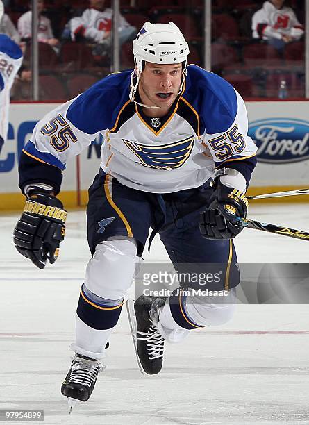 Cam Janssen of the St. Louis Blues skates against the New Jersey Devils at the Prudential Center on March 20, 2010 in Newark, New Jersey. The Blues...