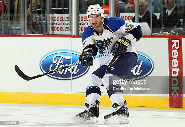 Cam Janssen of the St. Louis Blues skates against the New Jersey Devils at the Prudential Center on March 20, 2010 in Newark, New Jersey. The Blues...