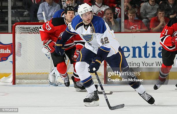 David Backes of the St. Louis Blues skates against the New Jersey Devils at the Prudential Center on March 20, 2010 in Newark, New Jersey. The Blues...