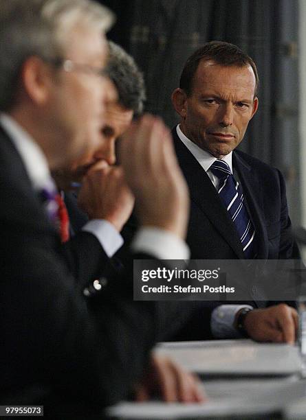 Australia's opposition leader Tony Abbott looks at Prime Minister Kevin Rudd during their debate at the National Press Club on March 23, 2010 in...