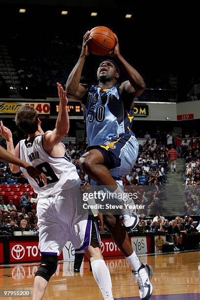 Zach Randolph of the Memphis Grizzlies gets to the basket against Beno Udrih of the Sacramento Kings on March 22, 2010 at ARCO Arena in Sacramento,...