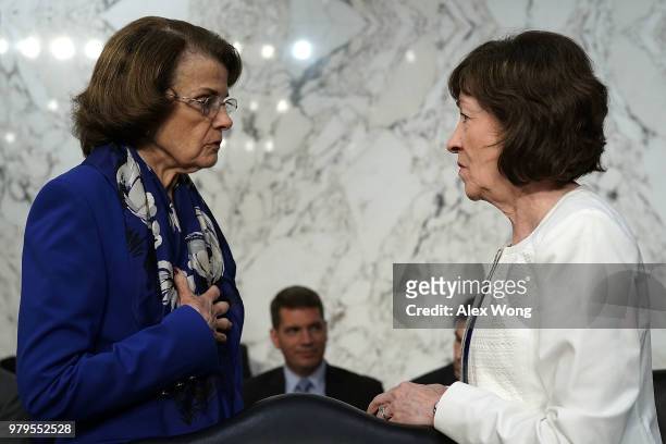 Sen. Dianne Feinstein talks to Sen. Susan Collins prior to a hearing before the Senate Intelligence Committee June 20, 2018 on Capitol Hill in...