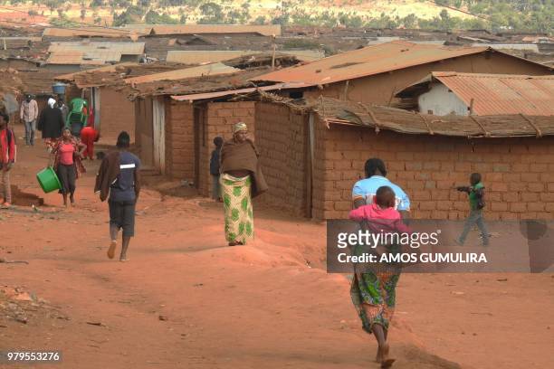 Refugees from various nationality walk through Dzaleka Refugee camp during commemorations to mark World Refugee Day at Dzaleka Refugee Camp in Dowa...