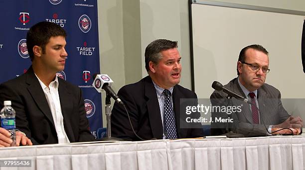 Catcher Joe Mauer , General Manager Bill Smith and President Dave St. Peter of the Minnesota Twins answer questions at the press conference to...