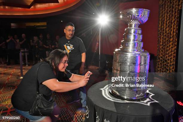 Fans check out the Stanley Cup on display ahead of the 2018 NHL Awards at the Hard Rock Hotel & Casino on June 17, 2018 in Las Vegas. Nevada. The...