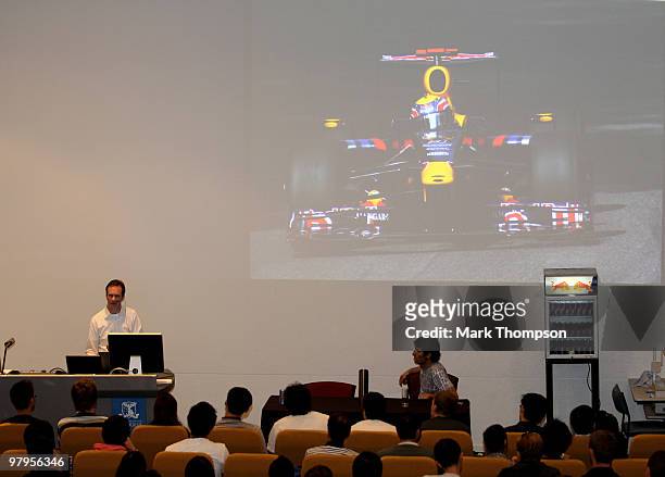 Mark Webber and Paul Monaghan of Red Bull Racing give a lecture at Melbourne university on the dynamics of a Formula 1 car during previews for the...