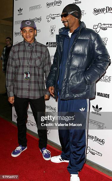 Singer Snoop Dogg and son Spank Atend the premiere of "Malice N Wonderland The Movie" on March 22, 2010 in Hollywood, California.