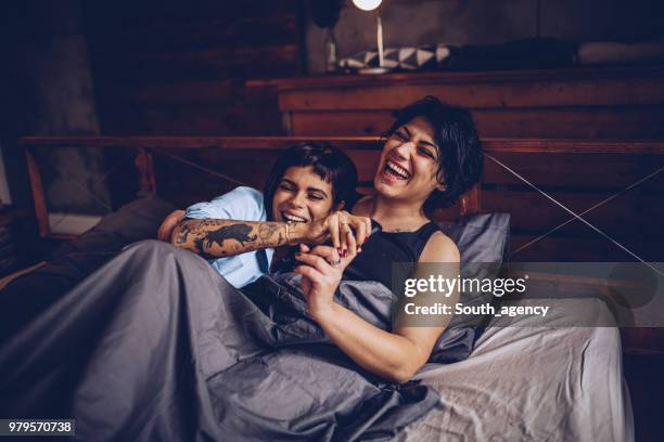 girlfriends fun in bed - lesbian bed stock pictures, royalty-free photos & images