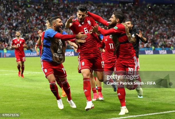 Saeid Ezatolahi of Iran celebrates after scoring his team's first goal, which is then ruled offside and disallowed during the 2018 FIFA World Cup...