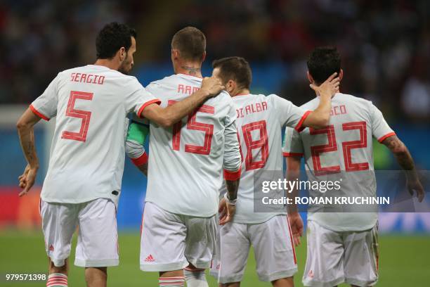 Spain's midfielder Sergio Busquets, defender Sergio Ramos, defender Jordi Alba and midfielder Isco celebrate a goal during the Russia 2018 World Cup...