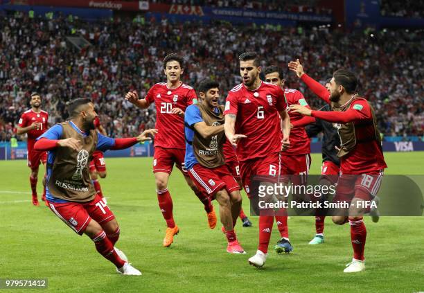 Saeid Ezatolahi of Iran celebrates after scoring his team's first goal, which is then ruled offside and disallowed during the 2018 FIFA World Cup...