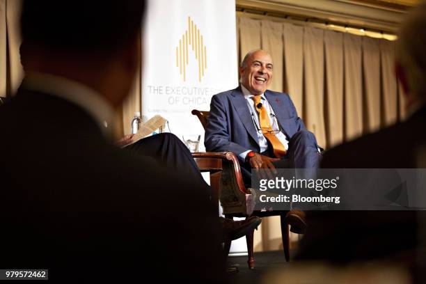 Muhtar Kent, chairman of the Coca-Cola Co., smiles during an Executives Club Of Chicago luncheon in Chicago, Illinois, U.S., on Wednesday, June 20,...