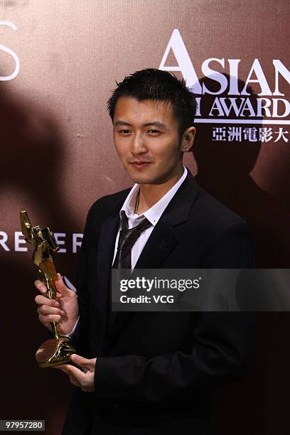 Hong Kong actor Nicholas Tse poses backstage after winning the Best Supporting Actor Award during the 4th Asian Film Awards Ceremony at the...