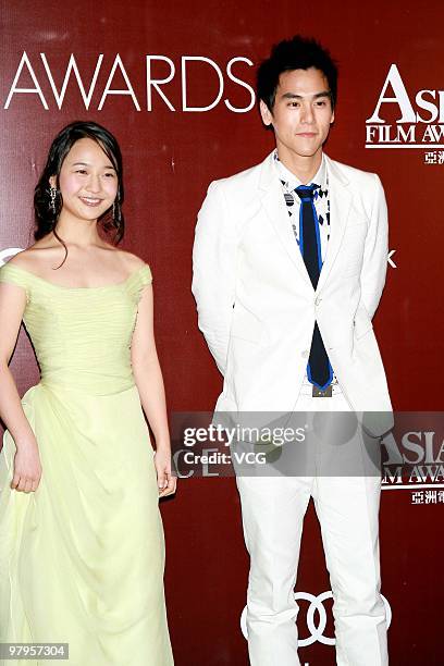 Taiwanese actor Eddie Peng and South Korean actress Kim Kkobbi pose on the red carpet for the 4th Asian Film Awards Ceremony at the Convention and...