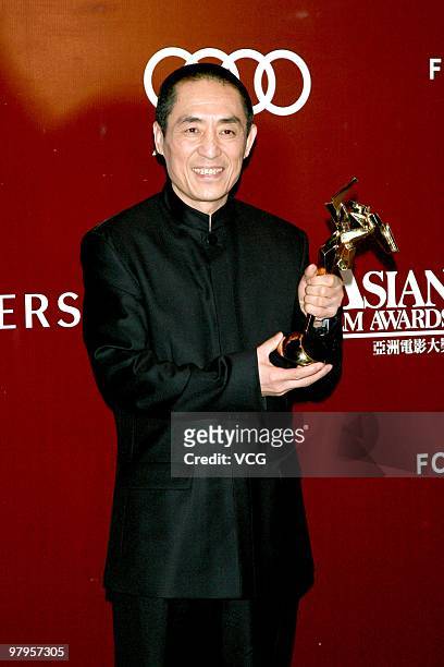 Chinese director Zhang Yimou poses backstage after after receiving the Outstanding Contribution to Asian Cinema Award during the 4th Asian Film...
