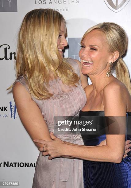 Actresses Kristen Bell and Kristin Chenoweth arrive at the "Backstage at the Geffen" gala at Geffen Playhouse on March 22, 2010 in Los Angeles,...