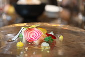 An exquisite dish of Marinated Amberjack by a Michelin Starred Chef. Selective Focus.