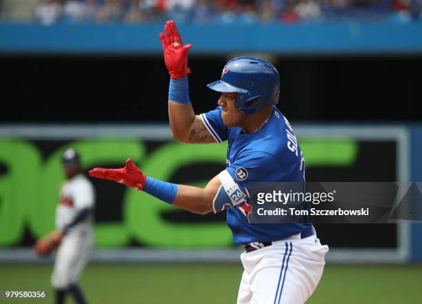 Yangervis Solarte of the Toronto Blue Jays celebrates an RBI single in the seventh inning during MLB game action against the Atlanta Braves at Rogers...