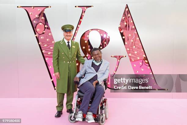 Yinka Shonibare poses with the Harrods Green Man at the Summer Party at the V&A in partnership with Harrods at the Victoria and Albert Museum on June...