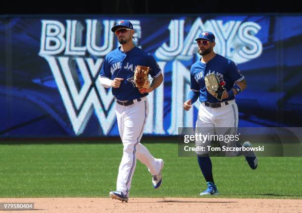 Randal Grichuk and Kevin Pillar of the Toronto Blue Jays celebrate a victory against the Atlanta Braves at Rogers Centre on June 20, 2018 in Toronto,...