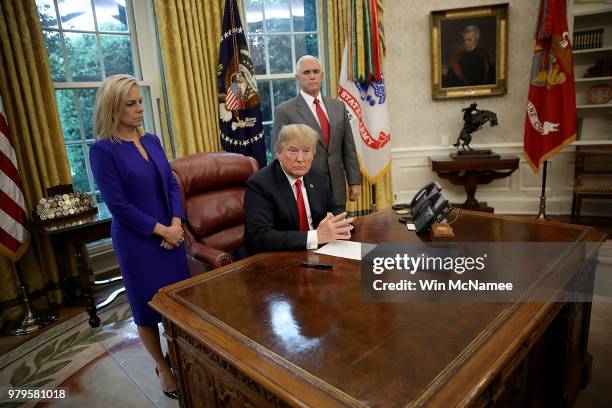 President Donald Trump, accompanied by Department of Homeland Security Secretary Kirstjen Nielsen and U.S. Vice President Mike Pence , prepares to...