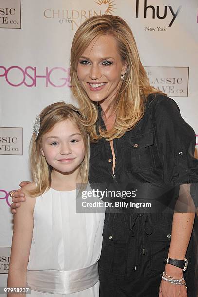 Actress Julie Benz and actress Julia Springer attend the POSHGLAM.COM to benefit children of the night at the Celebrity Vault on March 22, 2010 in...