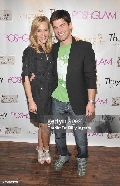 Actress Julie Benz and recording artist Jordan Johnson attend the POSHGLAM.COM to benefit children of the night at the Celebrity Vault on March 22,...