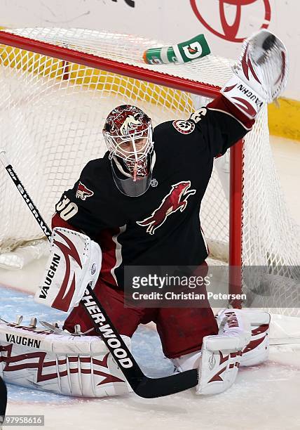 Goaltender Ilya Bryzgalov of the Phoenix Coyotes makes a glove save during the NHL game against the Chicago Blackhawks at Jobing.com Arena on March...