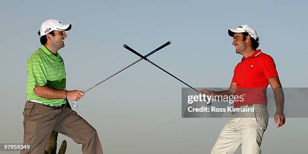 Brothers, Francesco Molinari and Edoardo Molinari of Italy sword fighting with a golf club after a practice round prior to The Comercialbank Qatar...