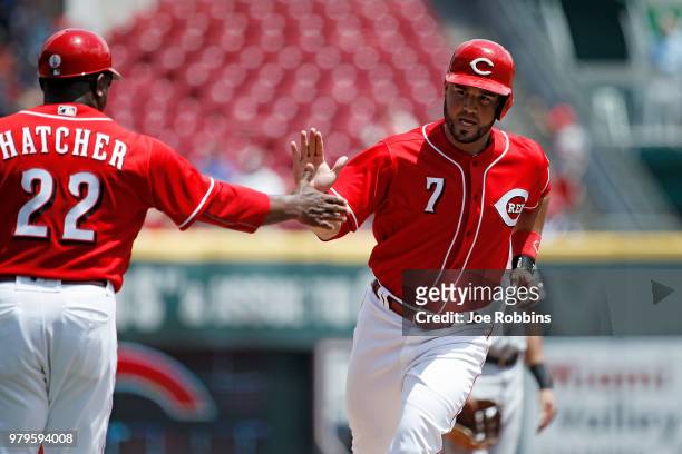 Eugenio Suarez of the Cincinnati Reds rounds the bases after hitting a solo home run to give his team a one-run lead in the sixth inning against the...