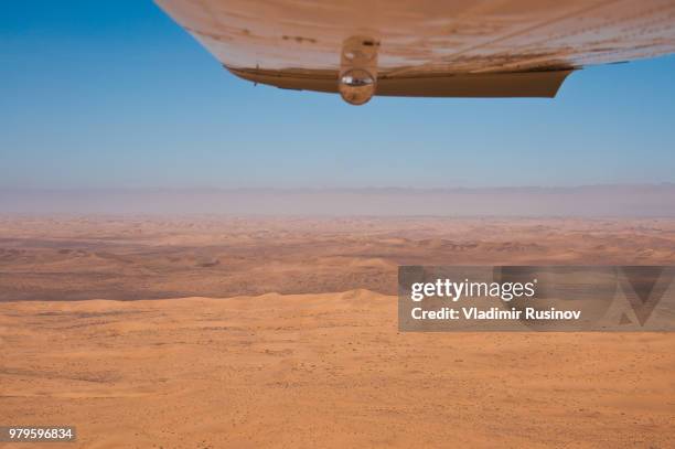 fly over namib desert. namibia, africa. - namibia airplane stock pictures, royalty-free photos & images