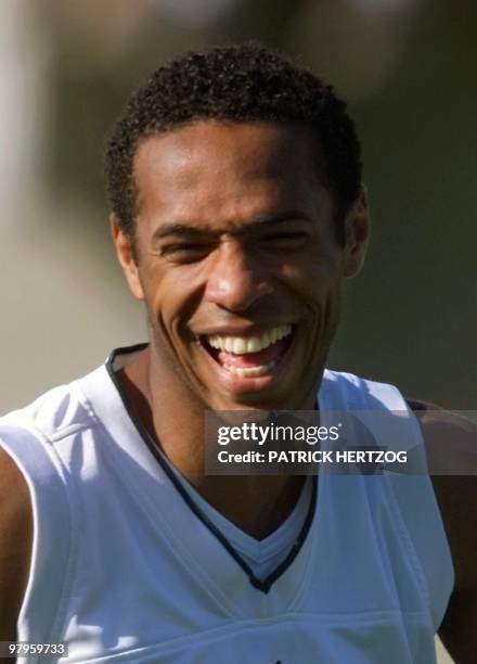 French forward Thierry Henry jokes with temmates during a training session of the French team at Wavre stadium, south of Brussels, 19 June 2000, one...