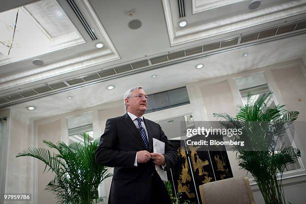 Peter Voser, chief executive officer of Royal Dutch Shell Plc, prepares to leave a media briefing in Beijing, China, on Tuesday, March 23, 2010....