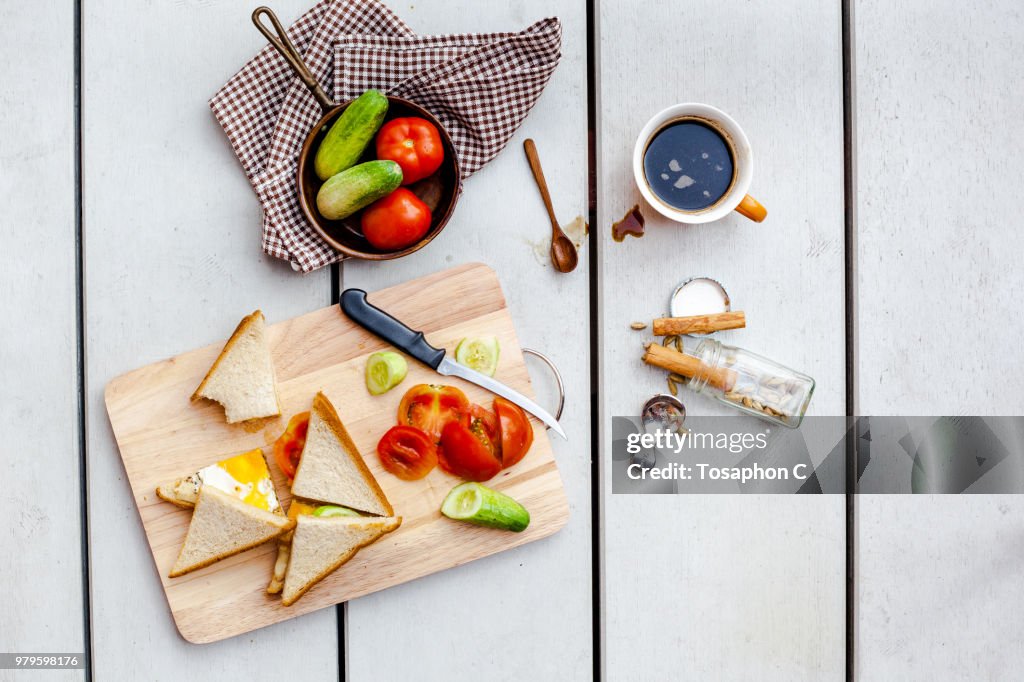 View from above at healthy breakfast with fresh vegetables bread and coffee