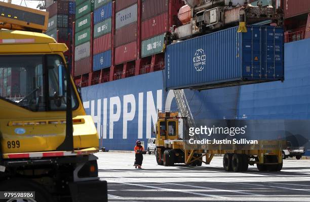 Shipping container is offloaded from the Hong Kong based CSCL East China Sea container ship at the Port of Oakland on June 20, 2018 in Oakland,...